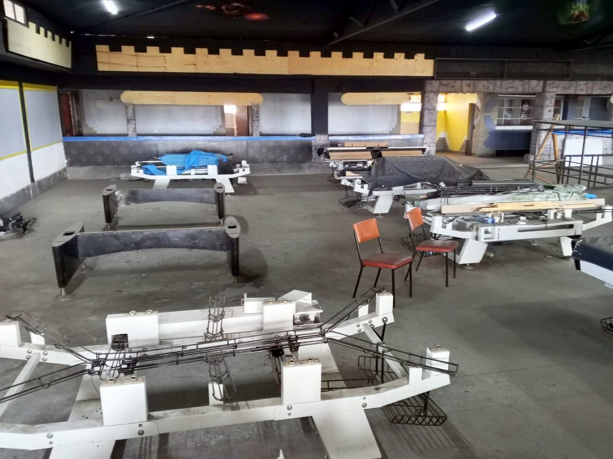 Pool table frames on the floor of the hall